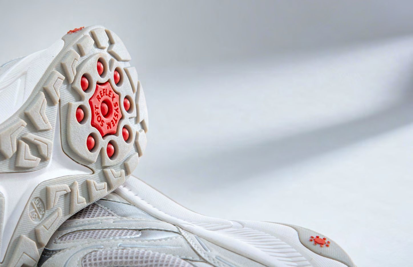 The sole of a Relife shoe, showing the SoftReflex massage elements in the heel